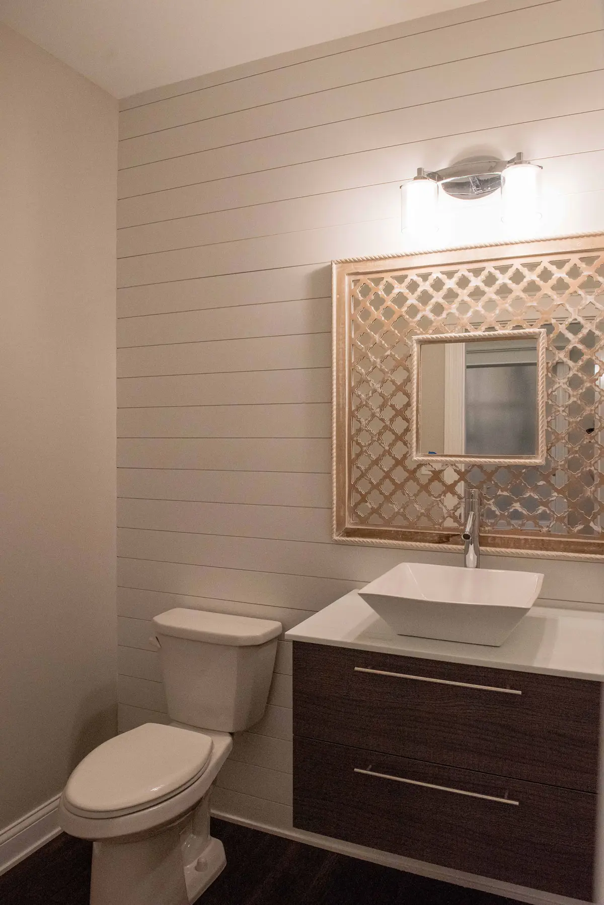 Powder room with custom mirror and vessel sink