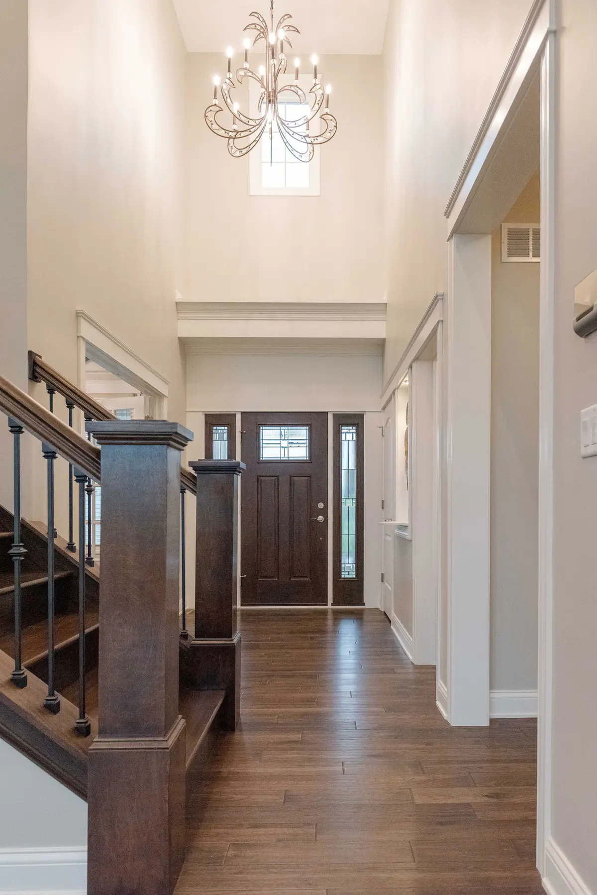 Foyer with custom front door and chandelier