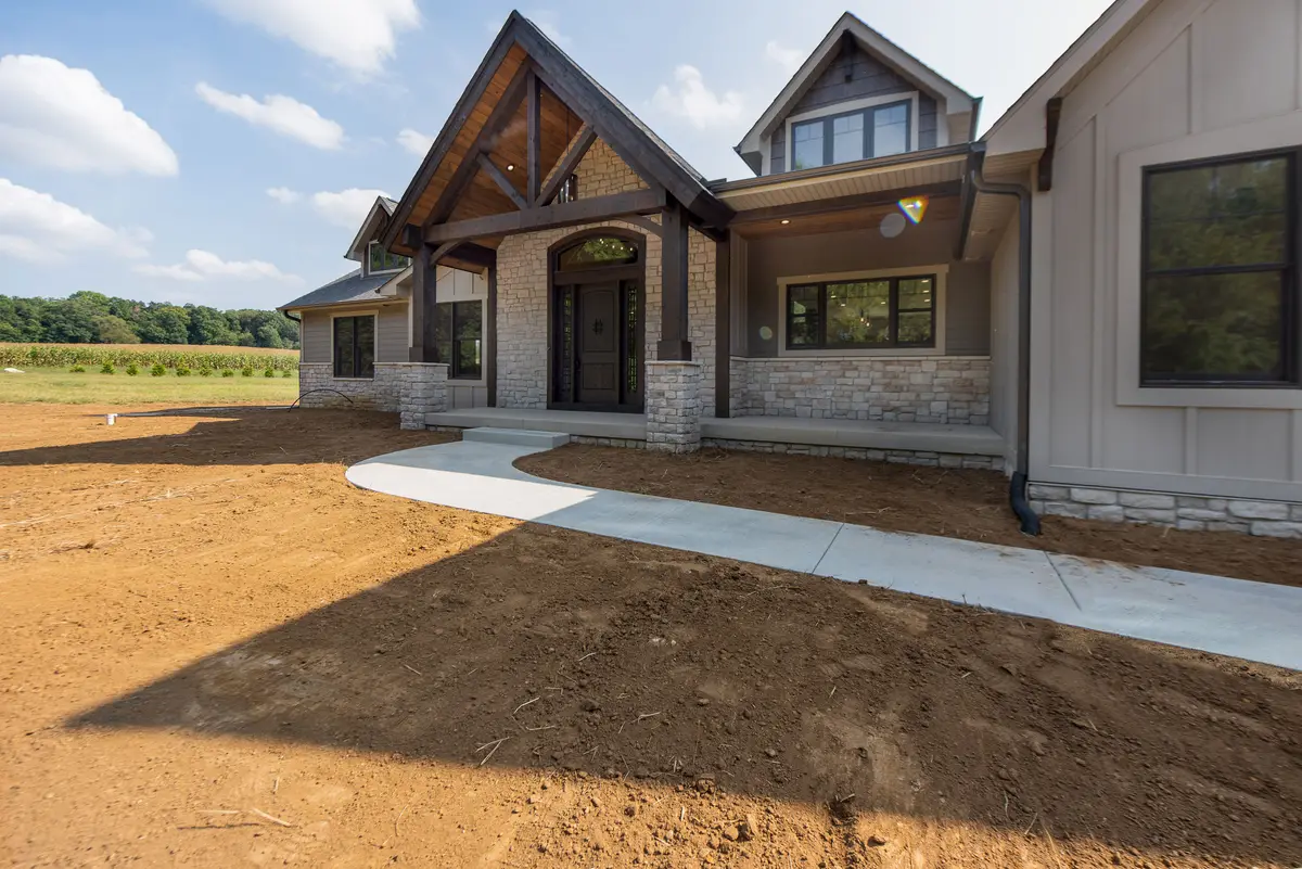 Stone-and-siding craftsman with timber porch
