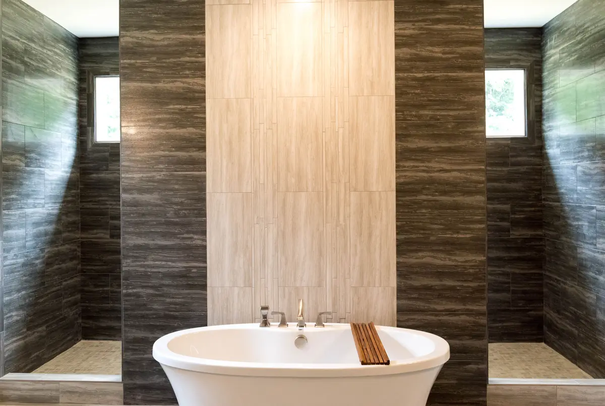 Spa-style master bath with freestanding tub and stone wall