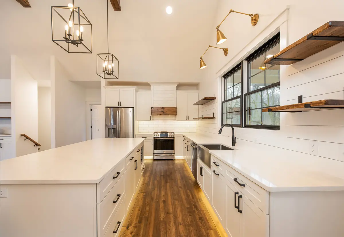 White kitchen with custom range hood