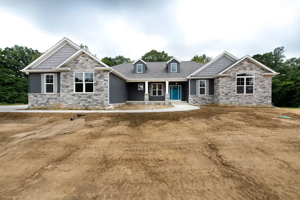 Wide craftsman elevation on a fresh build site