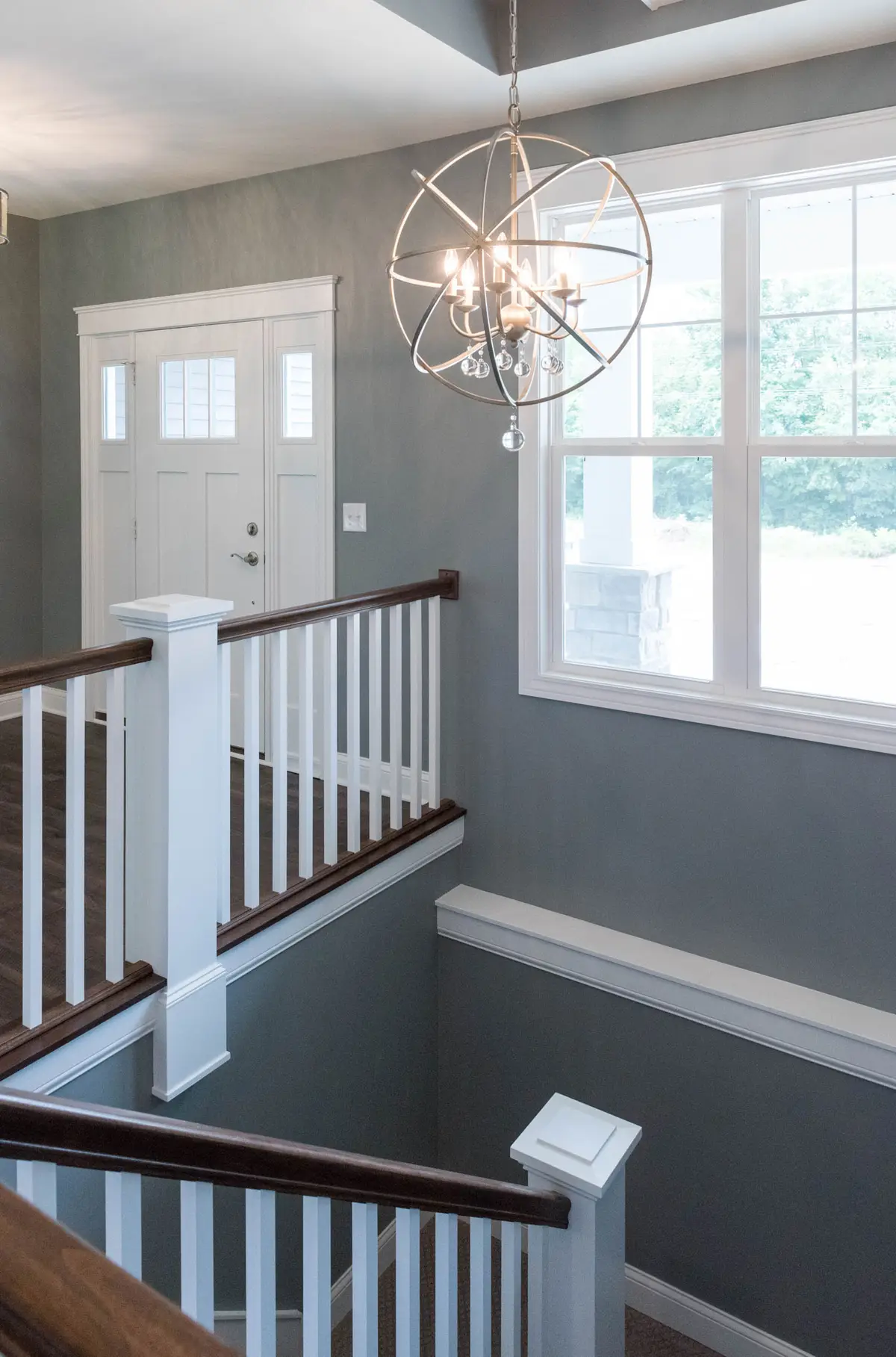 Living room overlooking custom stairwell