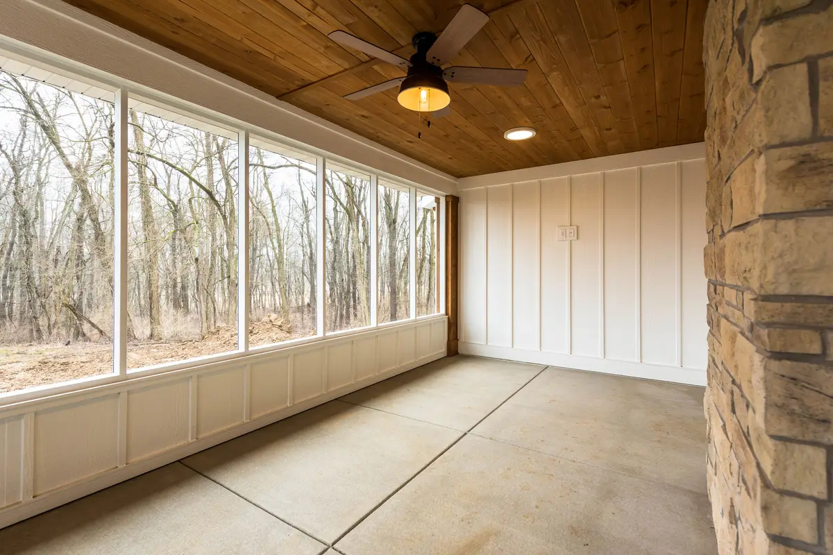 Screened porch with wood ceiling and fan