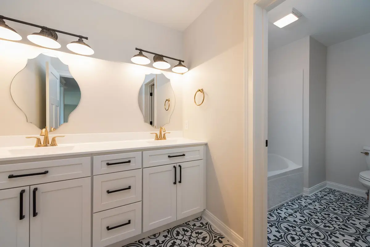 Bath with double vanity and tile floor