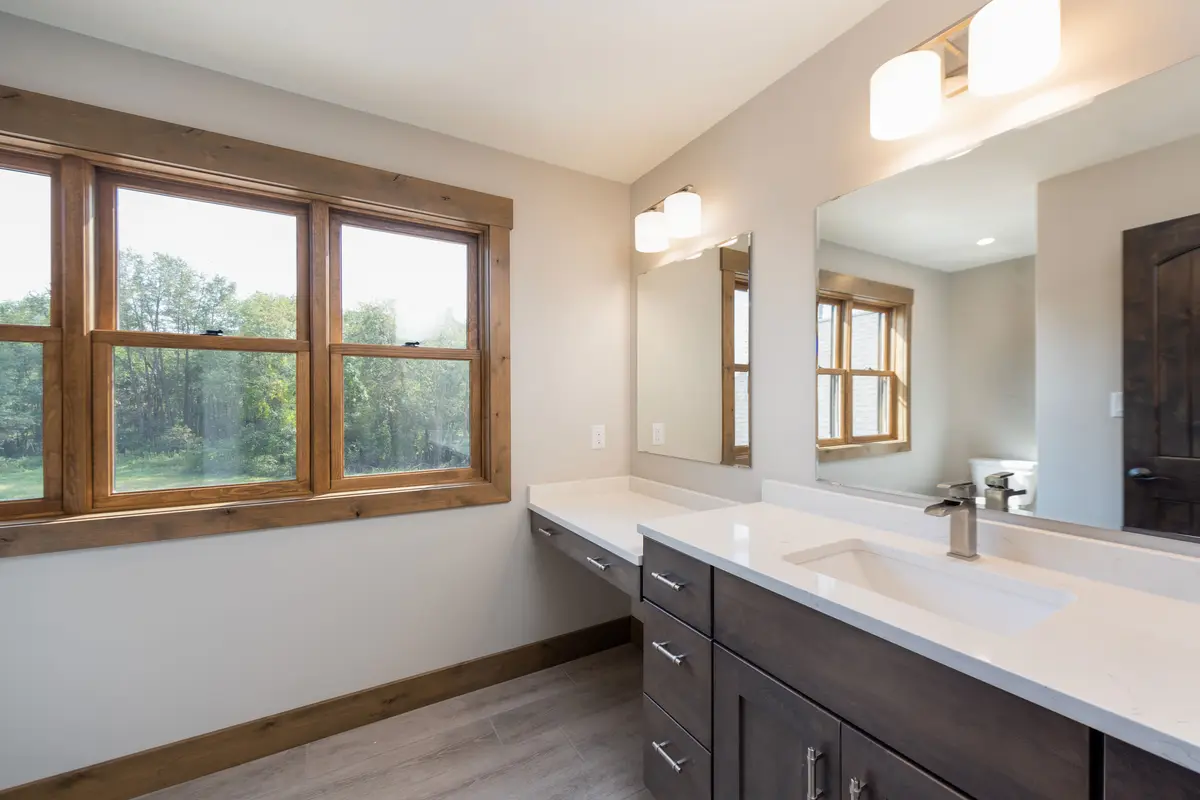 Master bath with double vanity and floor mirror