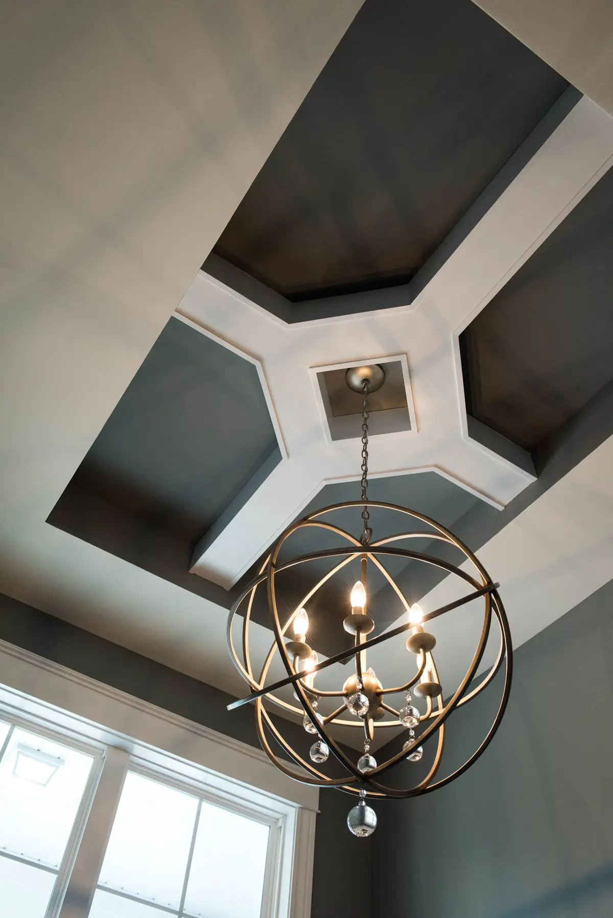 Coffered ceiling detail with iron chandelier